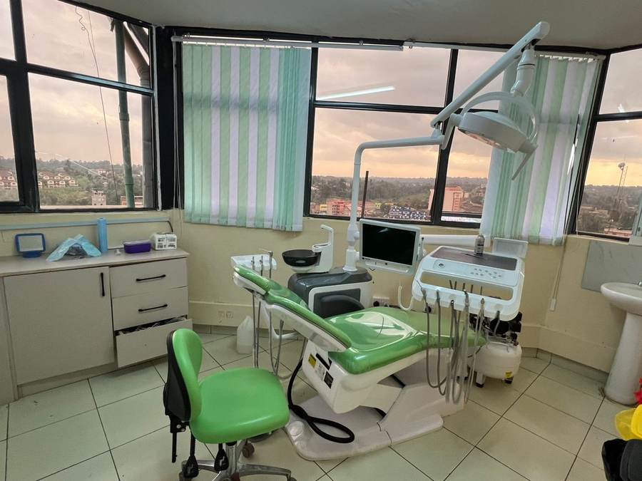 Dentist examining a patient's teeth at Elephant Dental Clinic, Biashara Street, Kiambu